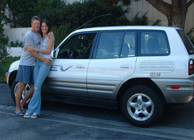 Picture of Ian Murray and Alexandra Paul in front of a Toyota Rav4 EV