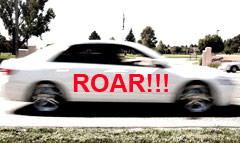 picture of a moving white car with word ROAR on it.