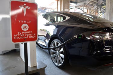 The trip began with a 35-minute charging session at the Tesla Supercharger station at Park Meadows Mall in Lone Tree, Colo. All four Supercharger stations were being used when I filled up at 10:30 a.m. on Monday. [Photo by Christof Demont-Heinrich]