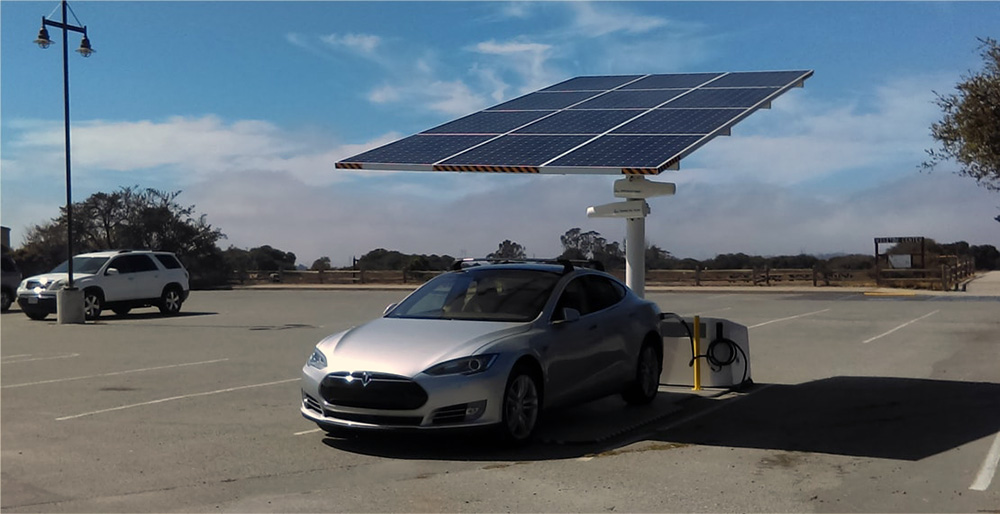 Solar EV charging station by Envision Solar with a Tesla charging